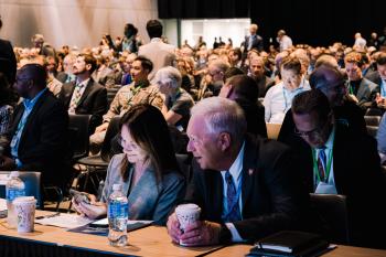 a group of people at a business or government conference meeting