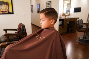 Boy in barber chair