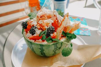 Close up of melon salad served in half of a watermelo