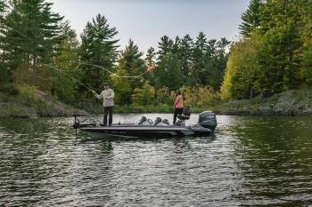 A couple fishing in a bass boat near Marquette, MI