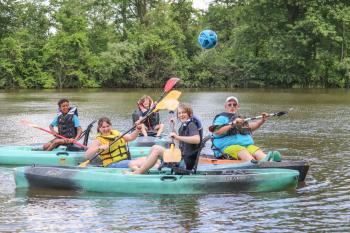 Picture of students and instructor in kayaks on the water at a Middle Susquehanna River Keeper Kayak Camp