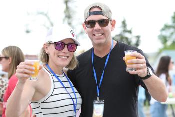 People toasting beer at the Haute Hops and Vines event