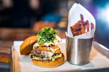 A Cheeseburger with a side of sweet potato fries from Farmer & the Cow.