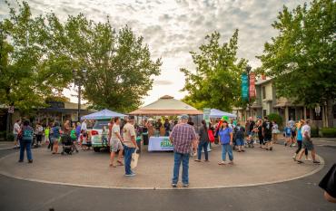Customers shop at vendor booths at Old Town Clovis Farmers Market