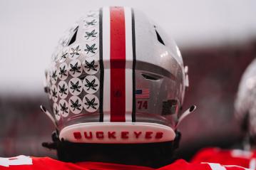 Ohio State University football helmet with buckeye stickers