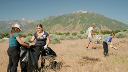 Volunteers clear out invasive weeds at the Leave it Loved event.