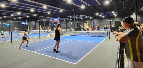 People on the pickleball courts at The Picklr