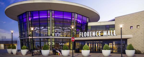 Florence Mall exterior with sign and potted landscaping.  Located in Florence, Ky.