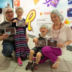 Family at Hershey's Chocolate World Attraction Create Your Own Candy Bar Experience