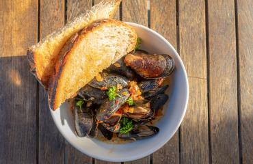 Mussels in bowl with bread from Copper Common