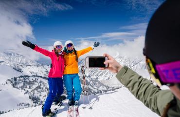 Friends at Snowbird taking a ski photo
