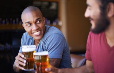 Men Drinking Beer - Stock