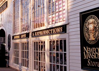 A storefront with a sign reading 'Newport Mansions Store'