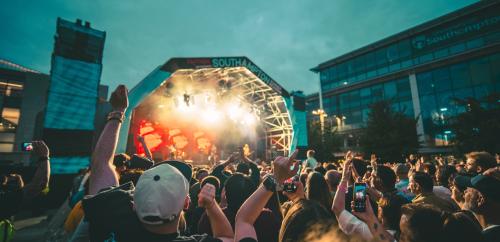 Crowd cheering at Southampton Summer Sessions in Guildhall Square