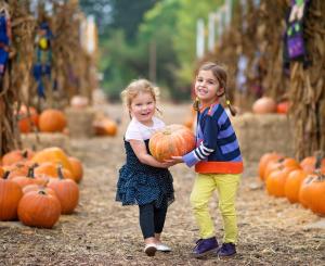 girls_carrying_pumpkin