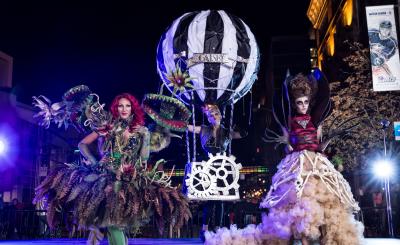 Three people in extravagant Halloween costumes