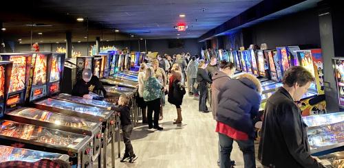 People at pinball machines at Recbar 812 in Southern Indiana