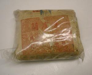 Package of Chinese tobacco wrapped in Chinese wrapping paper. Made in China. Found by Harry Lesley in the Gilroy Chinese Temple.