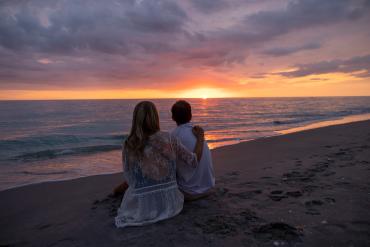 Couple enjoying sunset on the beach in Punta Gorda/Englewood Beach