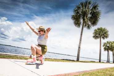 Woman roller blading along Charlotte Harbor in Punta Gorda, Florida