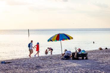 People enjoying the Gulf Coast shoreline at Englewood Beach in Southwest Florida