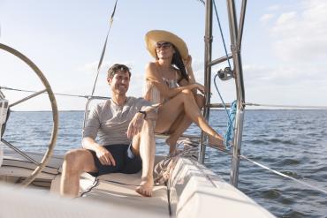 Couple enjoying a sailboat cruise on Charlotte Harbor.