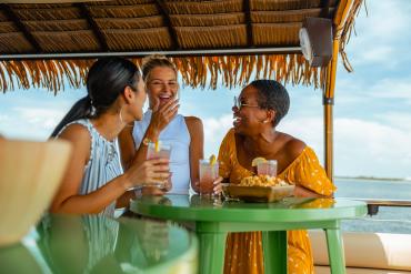Three women enjoy a tiki boat cruise in Punta Gorda/Englewood Beach
