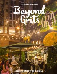 Beyond Grits Restaurants Guide. People having dinner at The Grove. Surrounded by night lights and a beautiful mural.