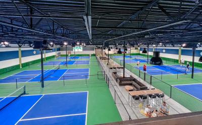 Interior of DiNK'd Pickleball facility showing courts