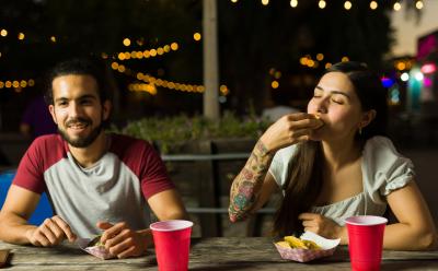 Couple enjoying street tacos together