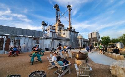Outdoor seating in adirondack chairs and picnic tables at TUPPS