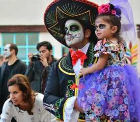 Father and daughter with traditional face painting