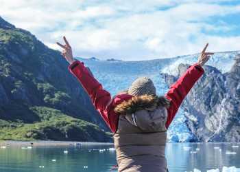 Exploring glacier in Blackstone Bay aboard a day cruise near Whittier, Alaska during summer.