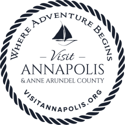 A rope circle logo with a sailboat