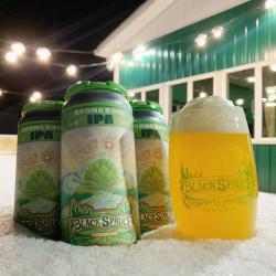 Four Aroma Dome Black Spruce IPA beers. Three beers are in cans, and one is in a glass.