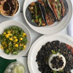 Plates of food from Madison trEats sit out on a table