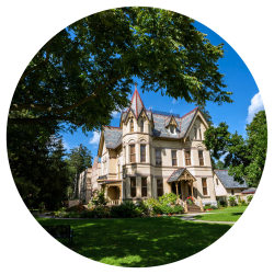 An 1800s heritage home shaded by mature tree