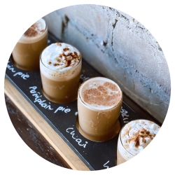 A flight of four lattes