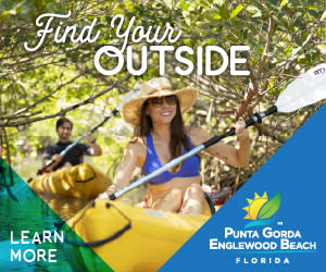 Couple Kayaking through a mangrove tunnel