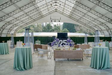 Gilroy Gardens Events Plaza tent with highboy tables, seating, and event decor