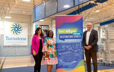 Nicolle Campbell, Director of Sales for Visit Fort Wayne poses with Fort Wayne Mayor Sharon Tucker and Turnstone CEO Mike Mushett at the announcement of the World Para Volley event at Turnstone.