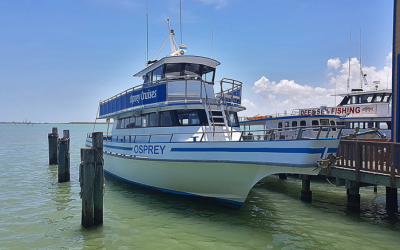 Osprey Cruis charter boat stationed at boat dock