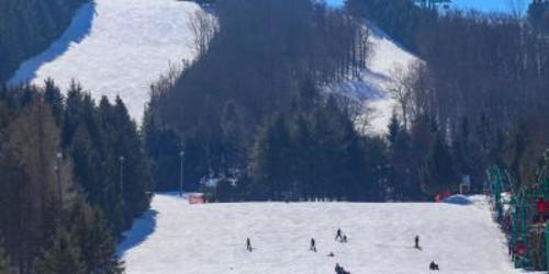Aerial view of people skiing down a mountain at Elk Mountain Ski Resort