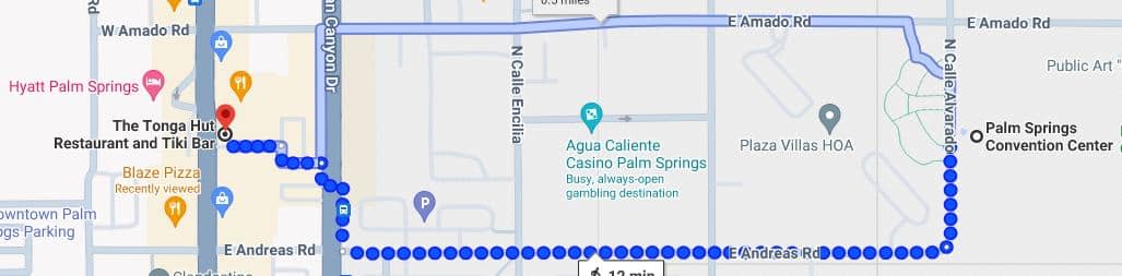 A map showing a blue dotted route from "Hyatt Palm Springs" passing by landmarks such as "The Tonga Hut Restaurant and Tiki Bar" and "Agua Caliente Casino Palm Springs" ending near "Palm Springs Convention Center".