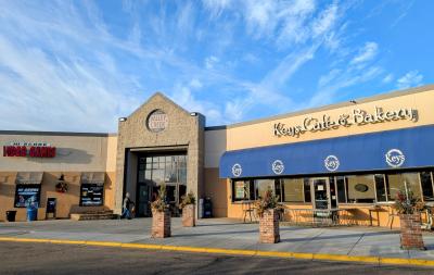 Valley Creek Mall entrance on a sunny morning with light clouds in the sky.