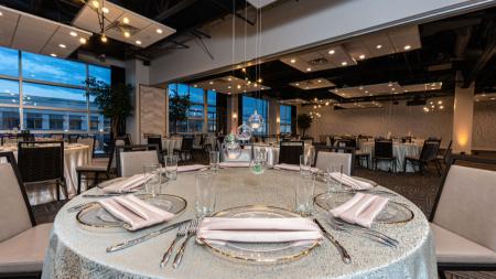 CRG Event Center, featuring floating table centerpieces and elegant lighting.