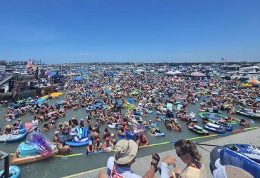 Crowd of people in the water at the bi-annual Boca Grande Sandbar Music Fest in Boca Grande, Florida