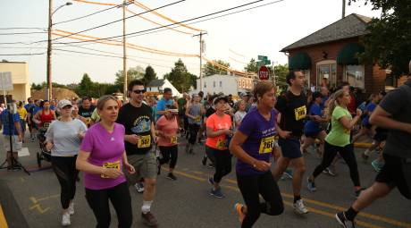 Participants running at the Jenkintown Sunset 5k Run