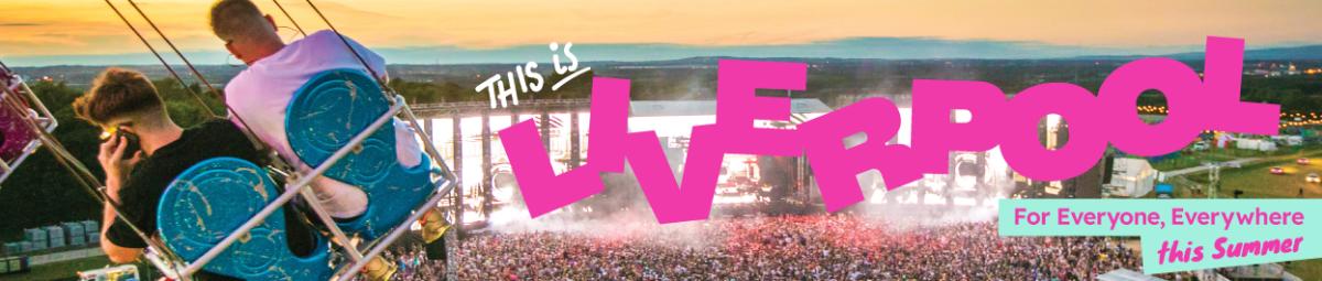 Two people on a swing over a music festival with a large crowd below them,