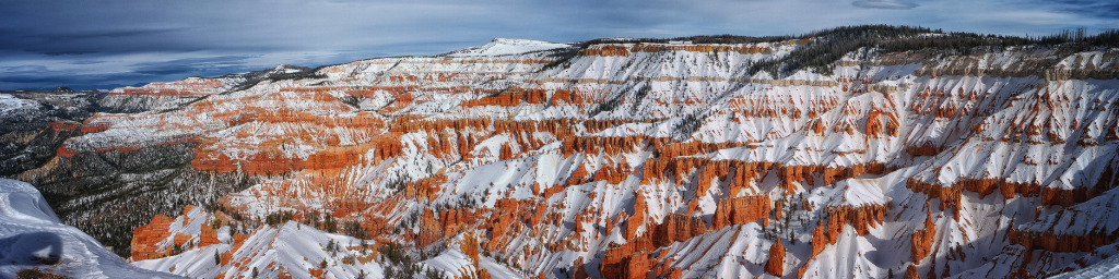 Red rock formations of Cedar Breaks National Monument in Southern Utah dusted with snow.